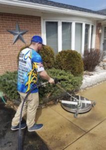 elite power washing team member at work